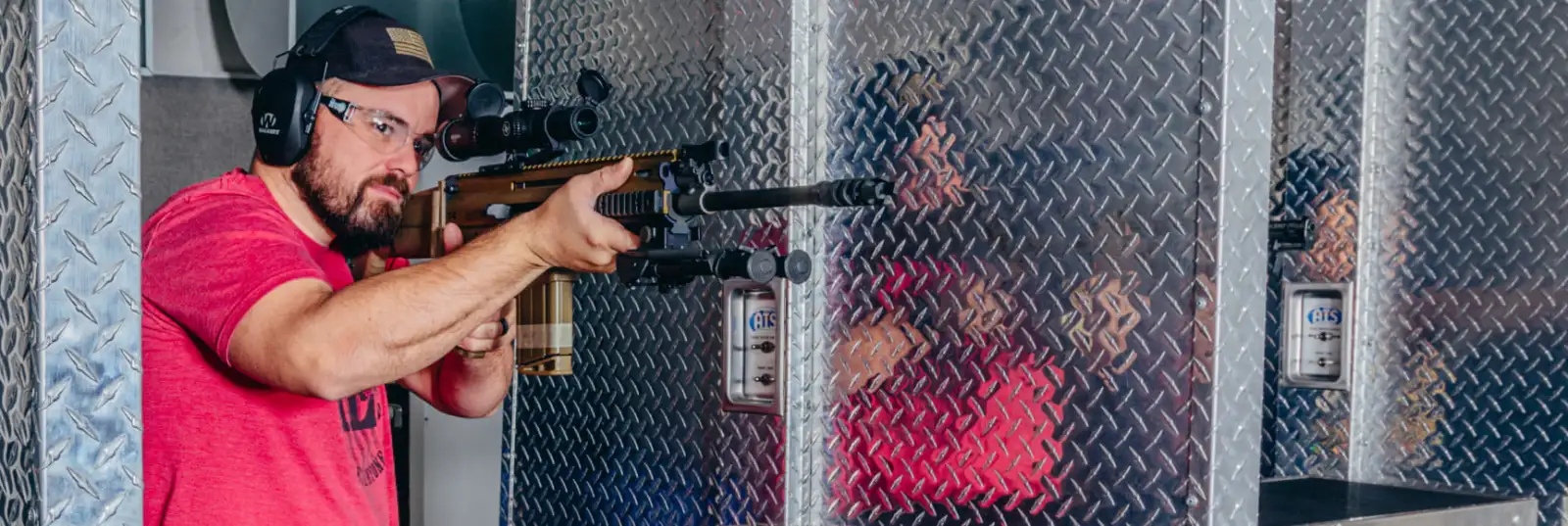 Customer practicing firearm handling at an indoor shooting range in Tucson